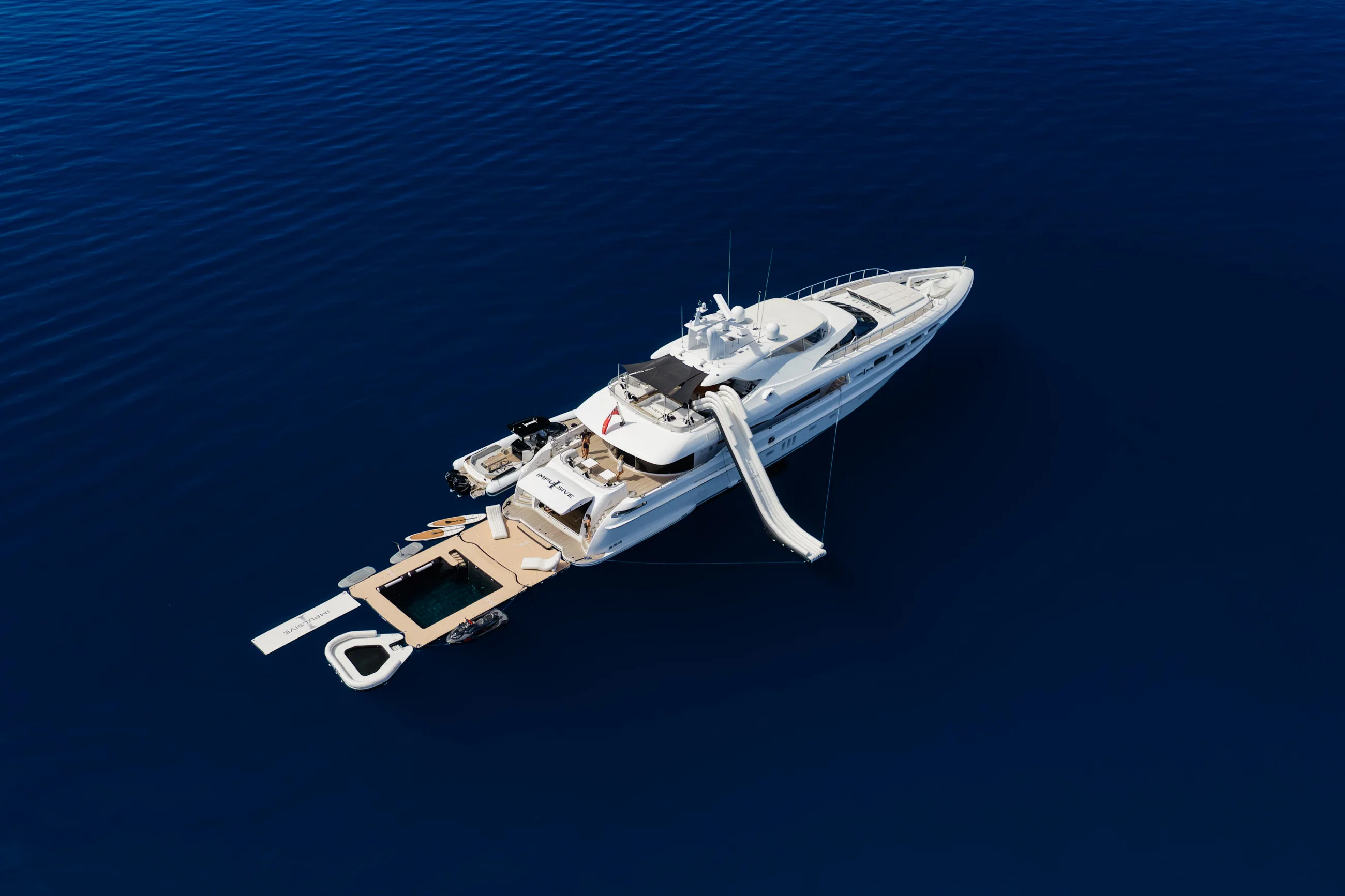 M/Y Impulsive at anchor inside a reef, aerial